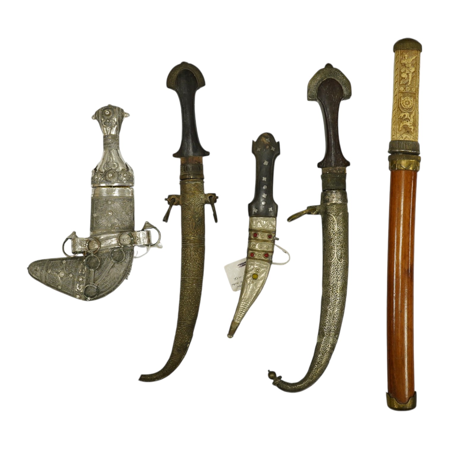 Five daggers; two Moroccan daggers Jambiya, one in brass sheath the other with silver faced brass sheath, both with wooden handles, a small Syrian dagger Shibriya with horn handle, a reproduction Japanese dagger tanto an